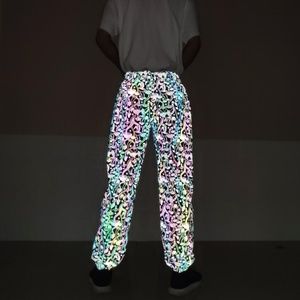 Male and female couples chaotic reflective pants